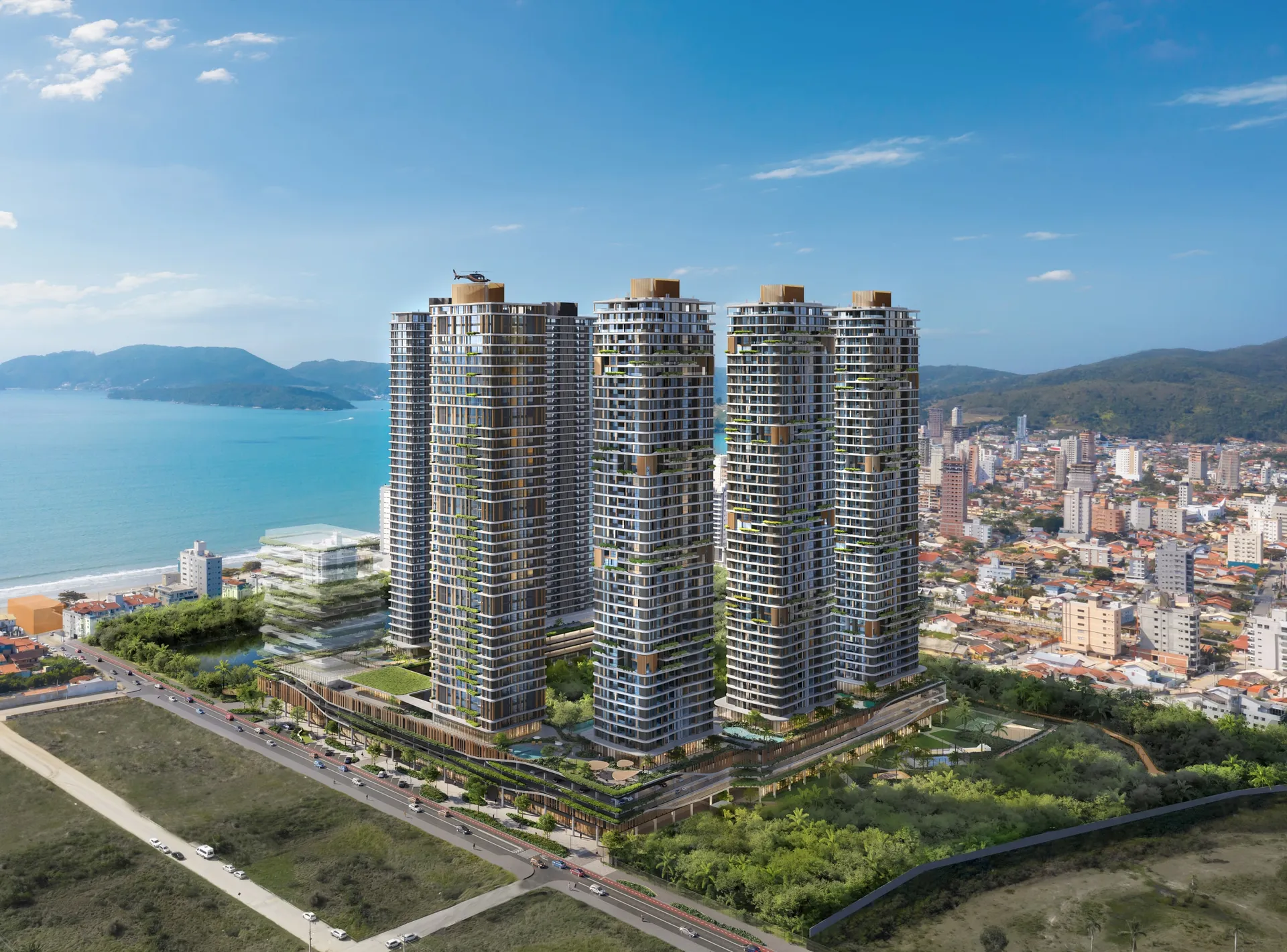 Vista aérea das torres do Lagom Perequê entre a mata do parque e o mar de Porto Belo