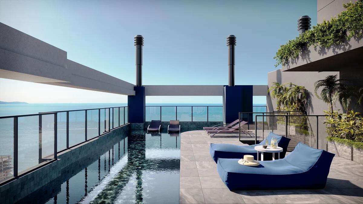 Piscina do rooftop com borda de vidro e vista para o mar